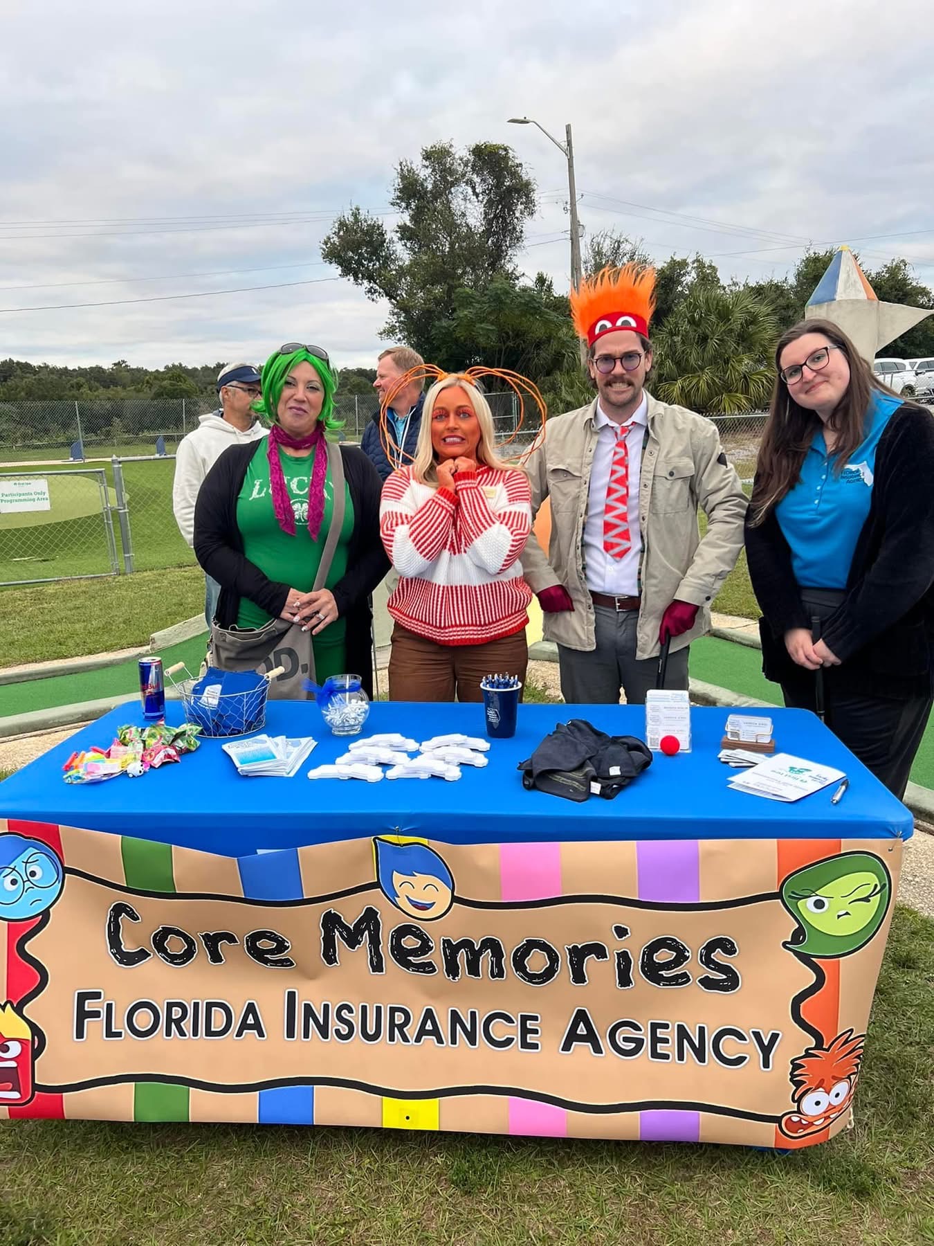 Core Memories Florida Insurance Agency crew in Inside Out costumes at their table