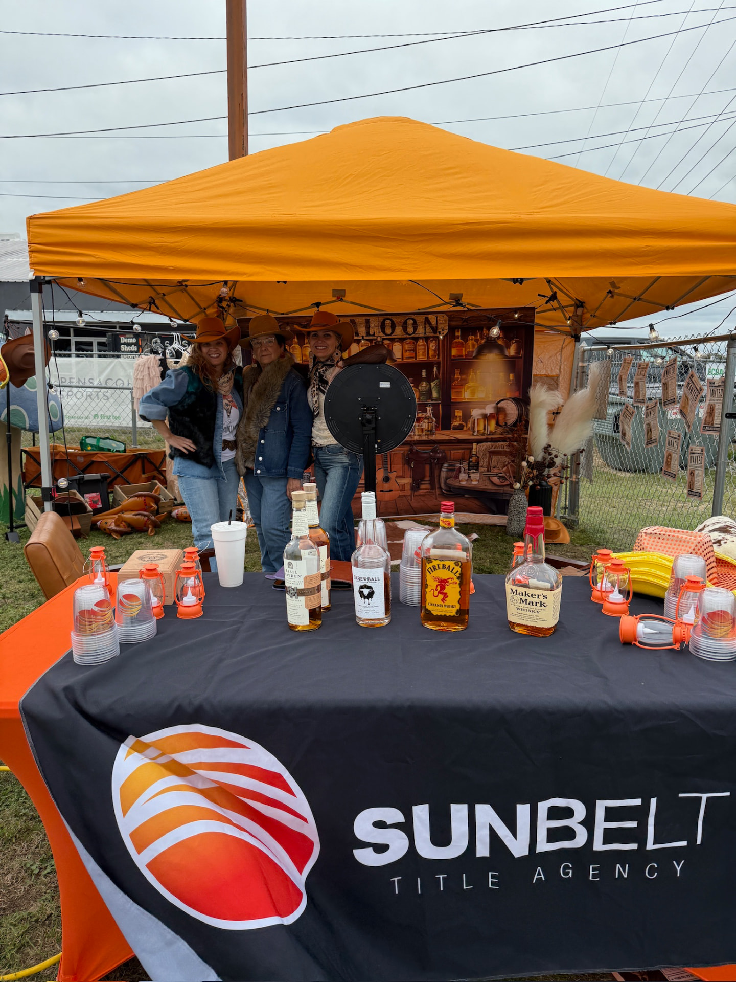 Sunbelt Title Agency's western saloon-themed sponsor tent at the mini golf bash