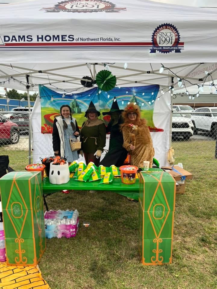 Adams Homes team dressed as Wizard of Oz characters at their sponsor tent